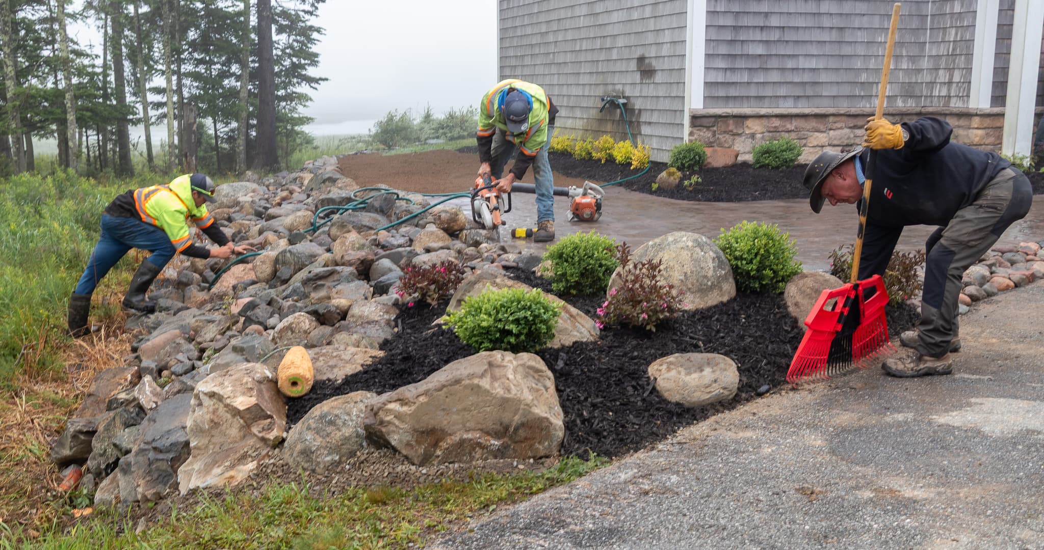 A photo of the team at Leavitts Lawn Care doing landscaping work