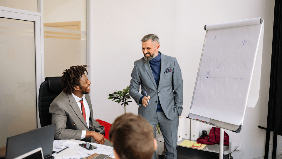 Image of a person using a flip chart during a business presentation