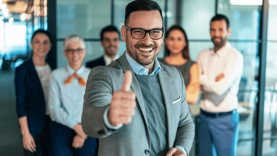Image of male office working giving a thumbs up 